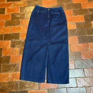 Vintage Liz Claiborne denim blue jean skirt with front and black slit vents.